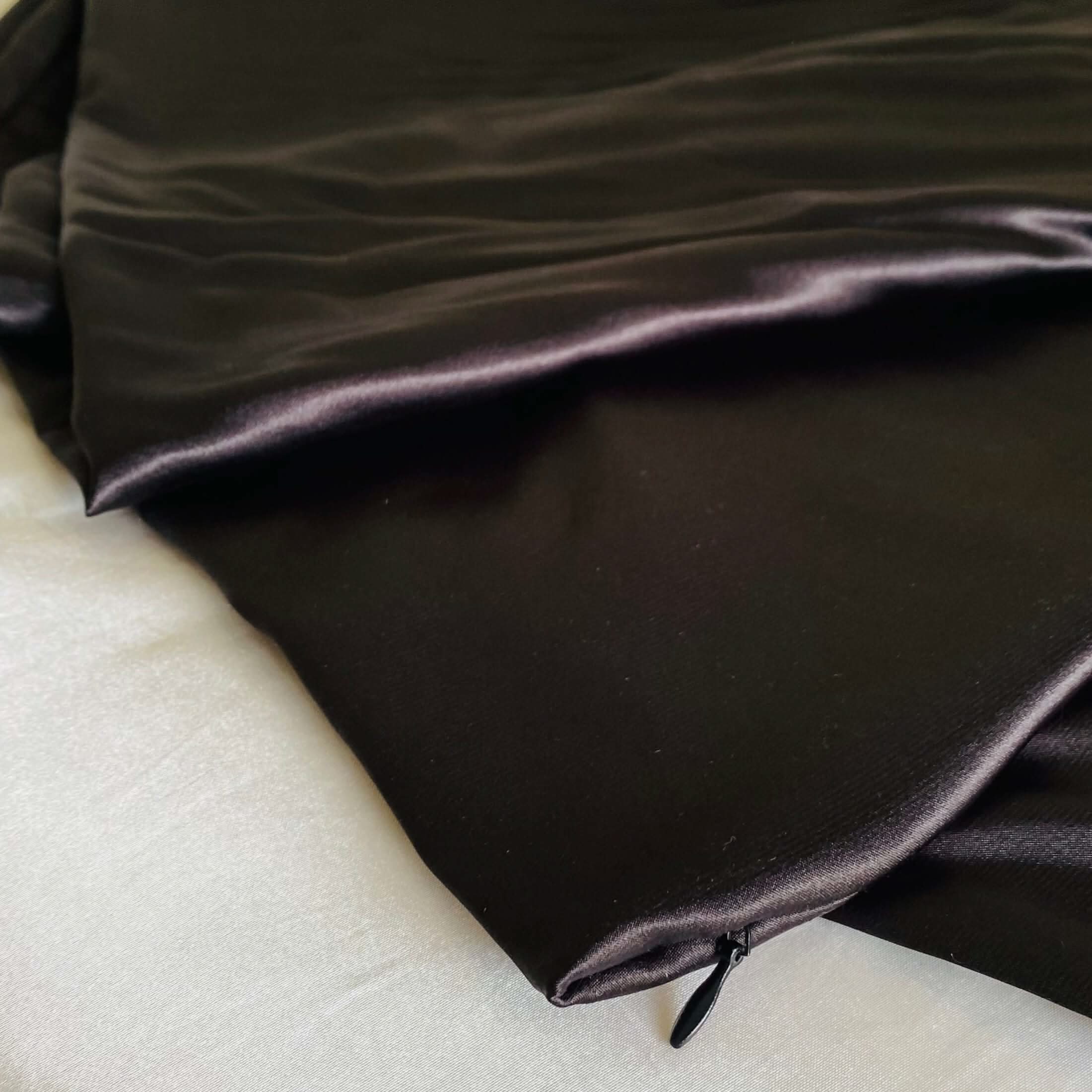 Close-up of the black satin Cooling Silk Cover with hidden zip