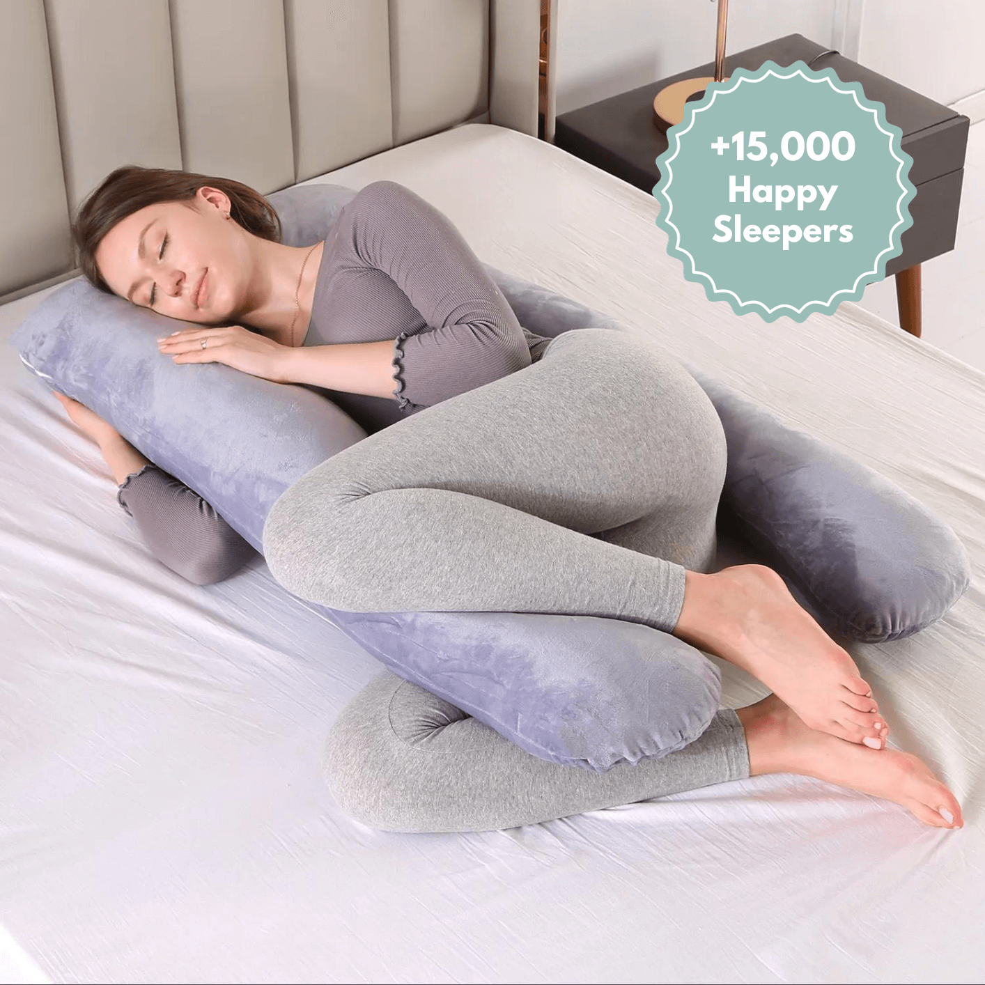 Woman side sleeping on the Cuddly Pillow™ by The Snuggles, 15,000 happy sleepers badge
