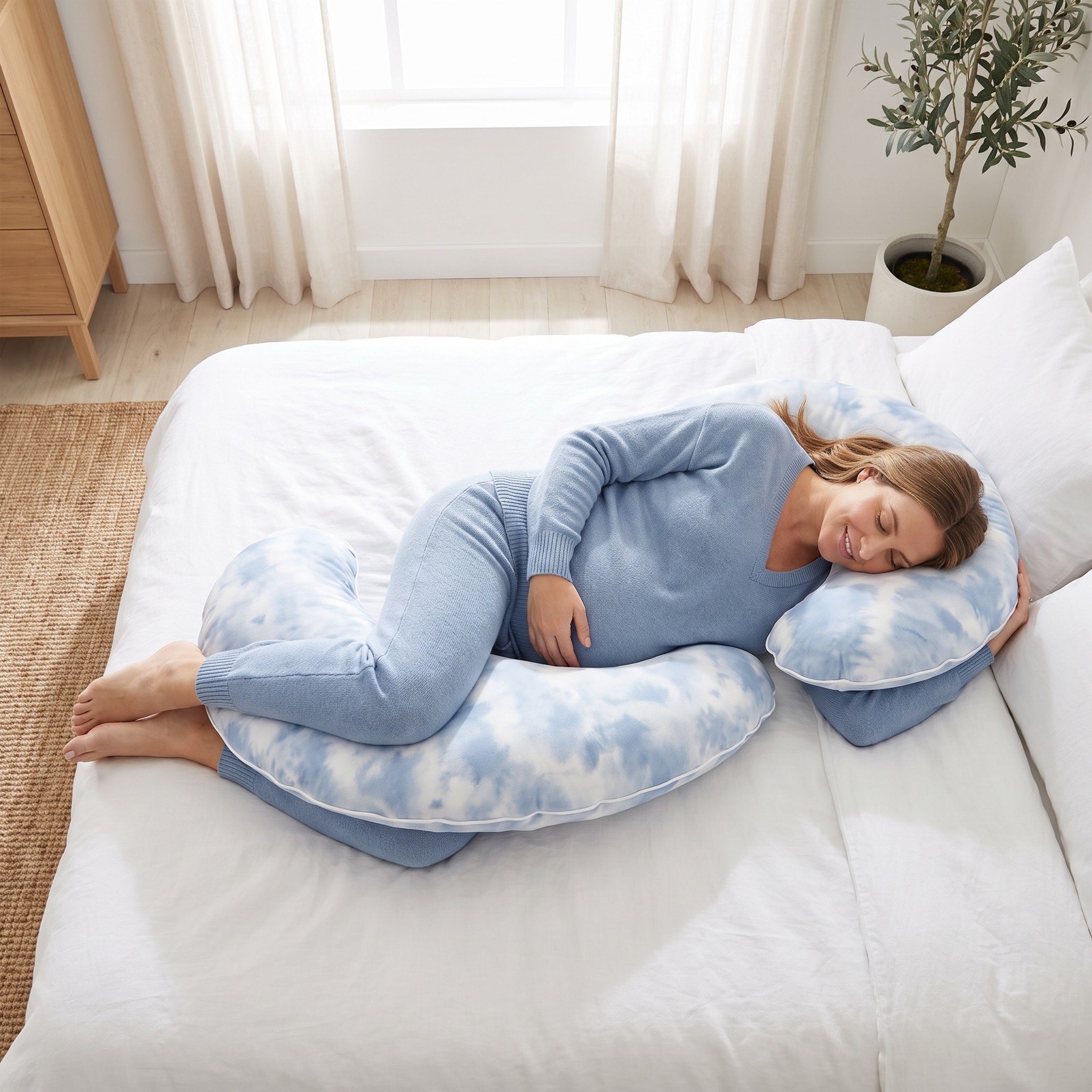 Pregnant woman using the Moon Pillow as a pregnancy support pillow