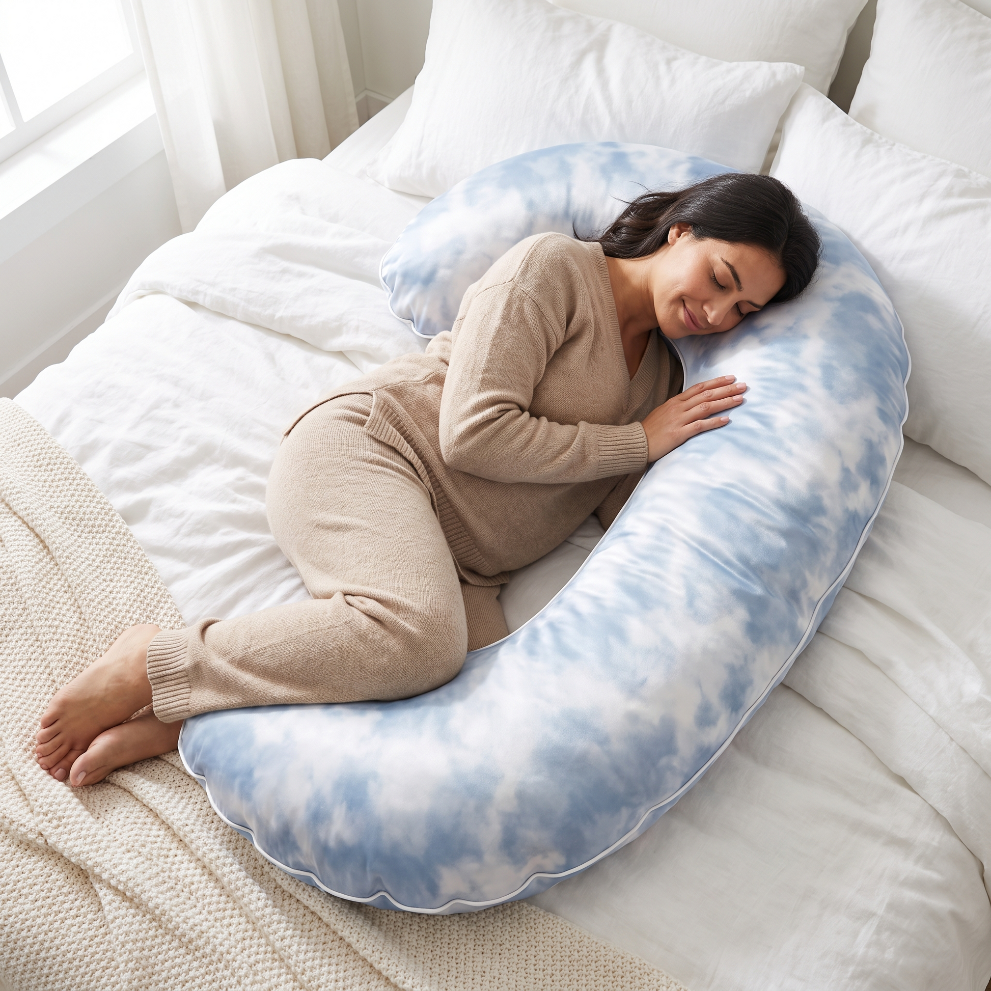 Close cozy view of a woman resting on the Moon Pillow cloud-pattern fabric