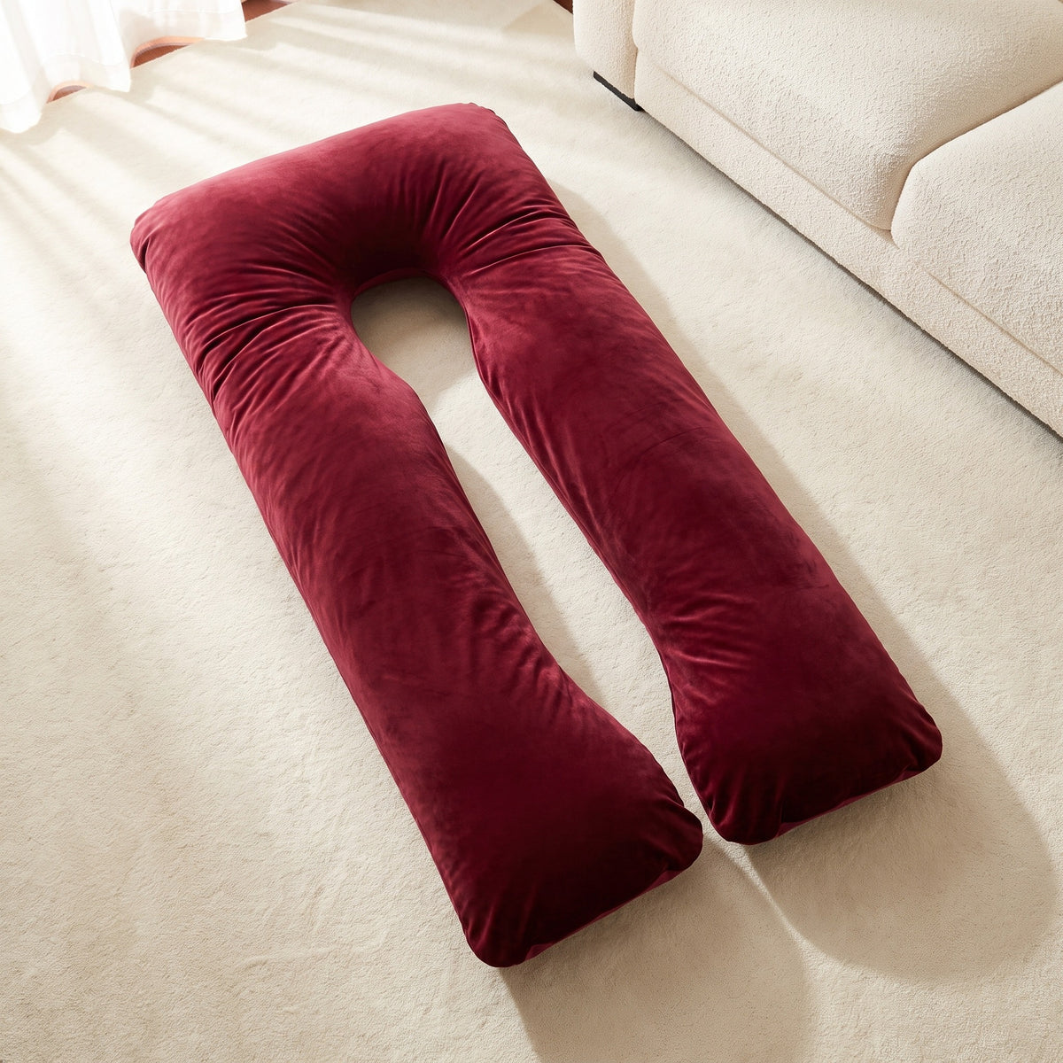 Full-length Red Satin Silk Cover fitted on the U-shaped Cuddly Pillow in soft daylight