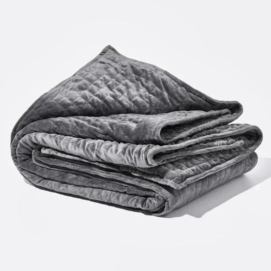 Folded grey quilted Weighted Blanket by The Snuggles